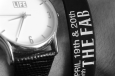 custom event wristband shown on wrist next to watch