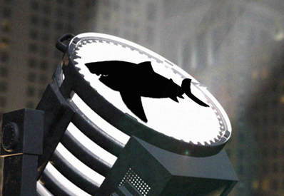 shark bat signal beaming into the night sky