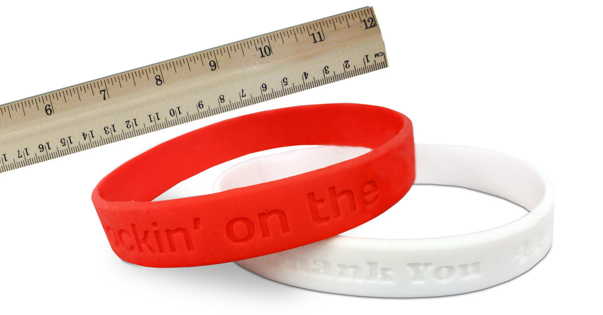 rubber bracelet size image showing ruler and two wristbands