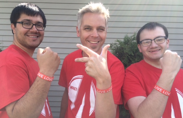 Student Ministry Staff at Christ Community Church holding up their wristbands