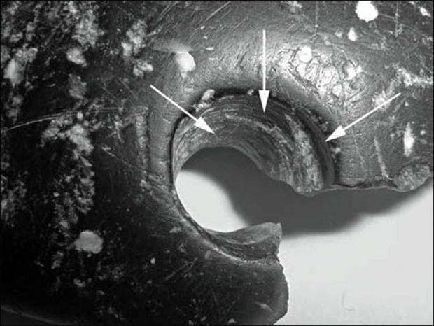 world's oldest bracelet with arrows pointing out impressive drilling