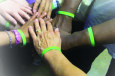 Sertoma Center wristbands being worn by team members
