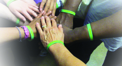 Sertoma Center wristbands being worn by team members