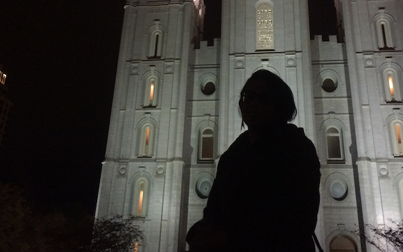 mysterious woman resting in front of Salt Lake Temple