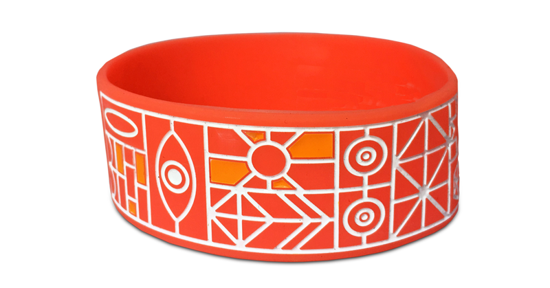 pattern wristband for event with intricate white and orange design