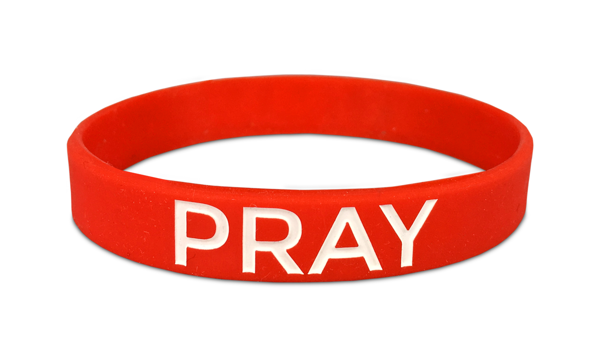 red christian wristband with the word pray in white