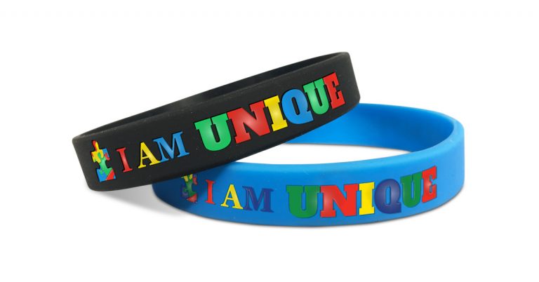 autism awareness wristbands with message saying I am unique