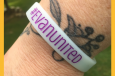 #evanunited wristbands worn on a wrist